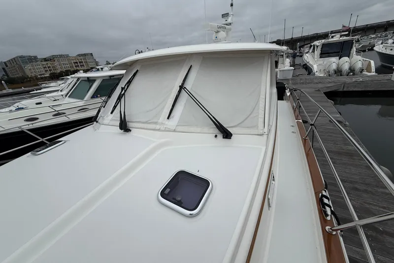 Kay Lee Jean Yacht Photos Pics 2023 Sabre 43 Salon Express yacht docked, featuring sleek design and modern amenities.