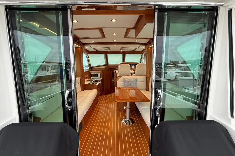 Kay Lee Jean Yacht Photos Pics Interior view of 2023 Sabre 43 Salon Express yacht, featuring elegant wood finishes and modern design.