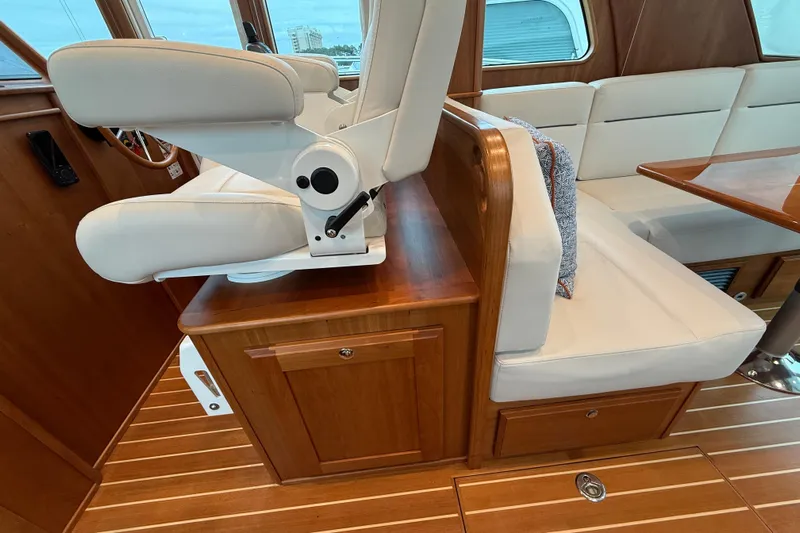 Kay Lee Jean Yacht Photos Pics 2023 Sabre 43 Salon Express interior with white seating and wooden finishes.