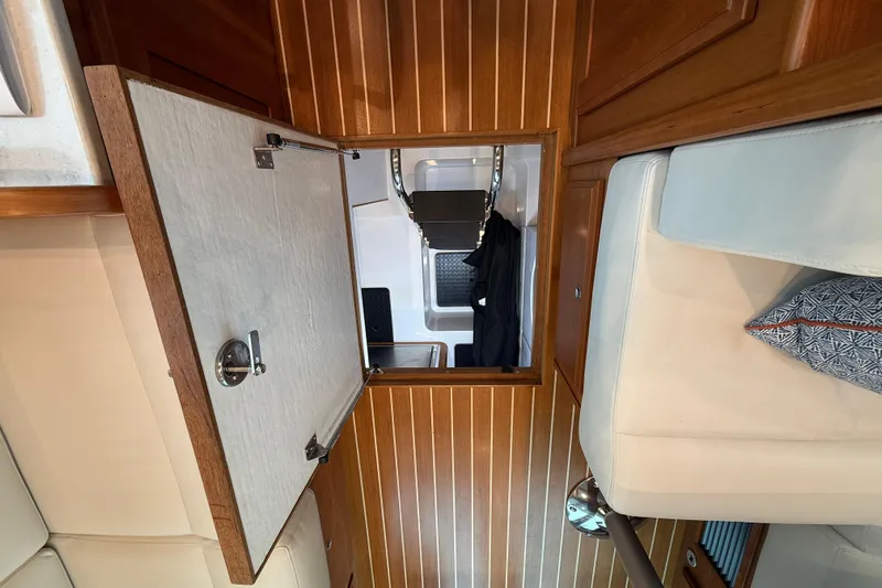 Kay Lee Jean Yacht Photos Pics 2023 Sabre 43 Salon Express interior with open wooden hatch and seating area.
