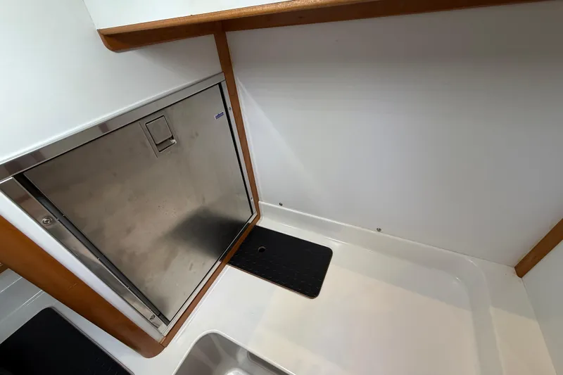 Kay Lee Jean Yacht Photos Pics Interior of 2023 Sabre 43 Salon Express yacht with stainless steel appliance.