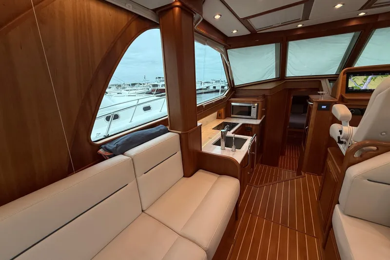 Kay Lee Jean Yacht Photos Pics Luxurious interior of 2023 Sabre 43 Salon Express yacht with elegant wood finish.
