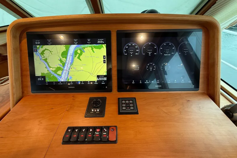 Kay Lee Jean Yacht Photos Pics 2023 Sabre 43 Salon Express dashboard with dual Garmin displays and control panel.