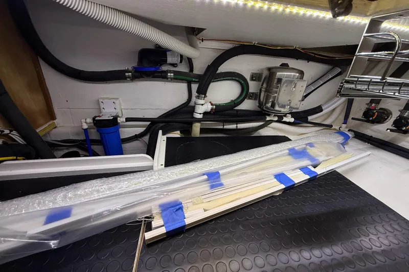 Kay Lee Jean Yacht Photos Pics Engine room of 2023 Sabre 43 Salon Express with pipes and equipment.