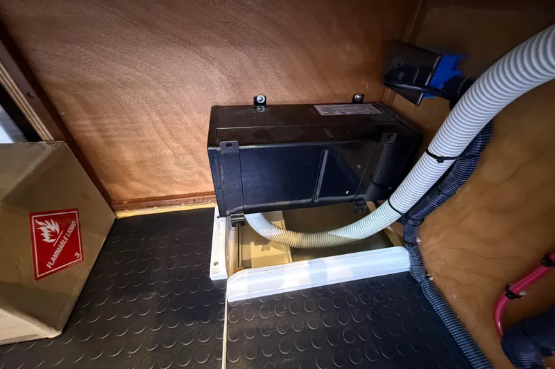 Kay Lee Jean Yacht Photos Pics 2023 Sabre 43 Salon Express interior with electrical components and flammable liquid warning.