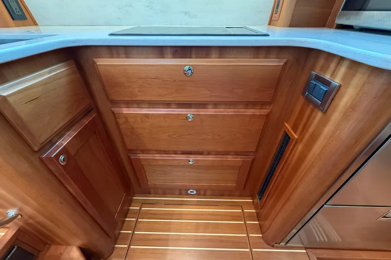 Kay Lee Jean Yacht Photos Pics 2023 Sabre 43 Salon Express interior with wooden cabinetry and modern design.