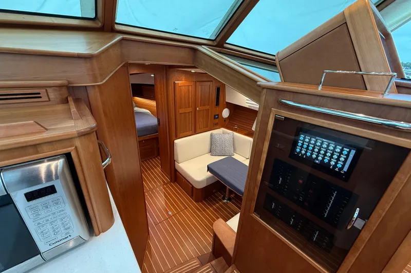 Kay Lee Jean Yacht Photos Pics Interior of 2023 Sabre 43 Salon Express yacht, featuring wood finishes and modern amenities.