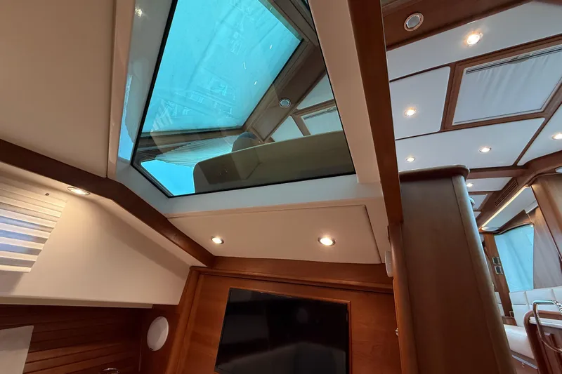 Kay Lee Jean Yacht Photos Pics Interior view of 2023 Sabre 43 Salon Express with skylight and elegant wood finish.