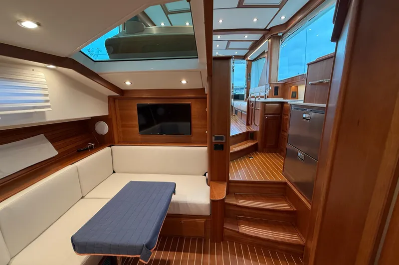 Kay Lee Jean Yacht Photos Pics Luxurious interior of 2023 Sabre 43 Salon Express yacht with elegant wood finish.