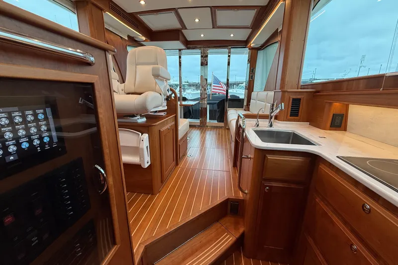 Kay Lee Jean Yacht Photos Pics Luxurious interior of 2023 Sabre 43 Salon Express yacht with elegant wood finishes.