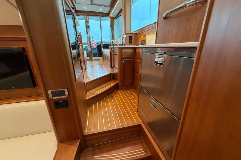 Kay Lee Jean Yacht Photos Pics Interior of 2023 Sabre 43 Salon Express yacht with wooden flooring and modern amenities.