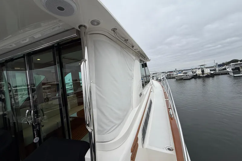 Kay Lee Jean Yacht Photos Pics 2023 Sabre 43 Salon Express yacht docked at marina, showcasing sleek design and luxury features.