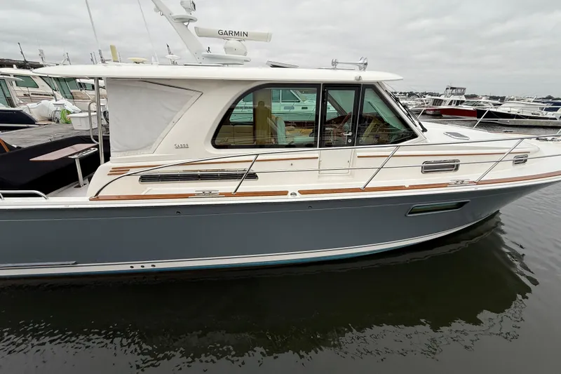 Kay Lee Jean Yacht Photos Pics 2023 Sabre 43 Salon Express yacht docked, featuring sleek design and modern amenities.