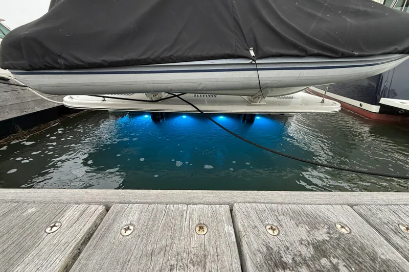 Kay Lee Jean Yacht Photos Pics 2023 Sabre 43 Salon Express with blue underwater lights at dock.