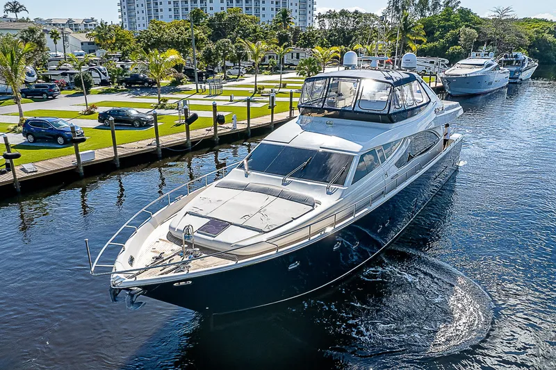 La Bella Vita Yacht Photos Pics 2006 Ferretti Yachts 830 cruising in a scenic marina setting.