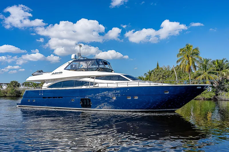 La Bella Vita Yacht Photos Pics 2006 Ferretti Yachts 830 cruising on a sunny day with blue skies and palm trees.
