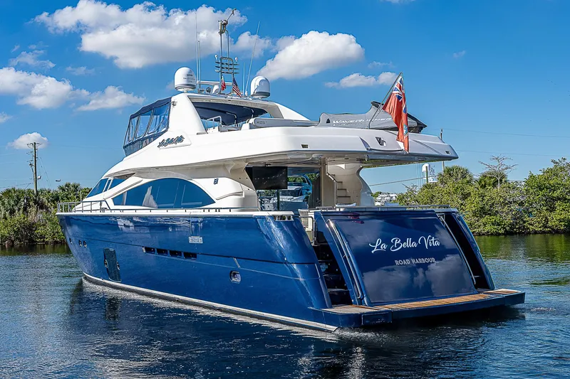 La Bella Vita Yacht Photos Pics 2006 Ferretti Yachts 830 on water, blue hull, clear sky background.