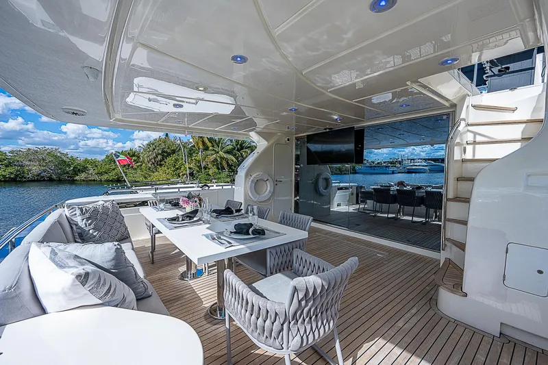 La Bella Vita Yacht Photos Pics Luxurious 2006 Ferretti Yachts 830 with elegant outdoor dining area and scenic water views.