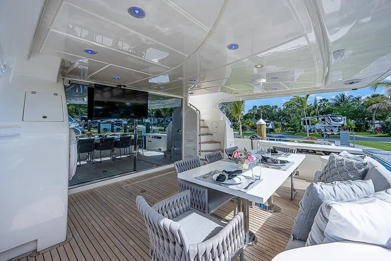 La Bella Vita Yacht Photos Pics Luxurious 2006 Ferretti Yachts 830 deck with elegant dining area and modern amenities.
