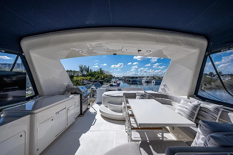 La Bella Vita Yacht Photos Pics Luxurious 2006 Ferretti Yachts 830 interior with elegant seating and scenic marina view.