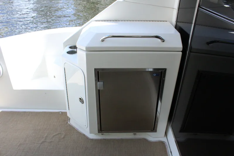 To The Moon And Back Yacht Photos Pics Cruisers Yachts 45 Cantius 2014 kitchen area with stainless steel fridge.