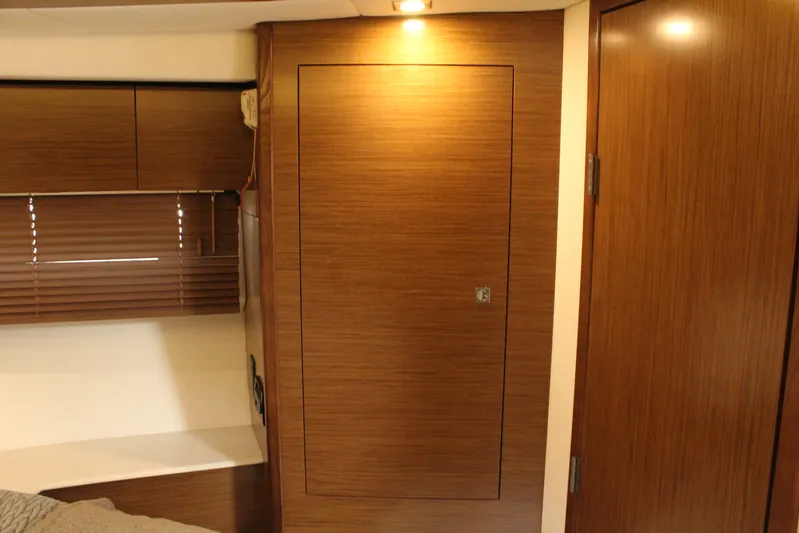 To The Moon And Back Yacht Photos Pics Interior of 2014 Cruisers Yachts 45 Cantius with wooden furnishings.