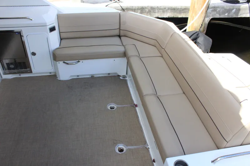 To The Moon And Back Yacht Photos Pics Interior of 2014 Cruisers Yachts 45 Cantius with beige seating.