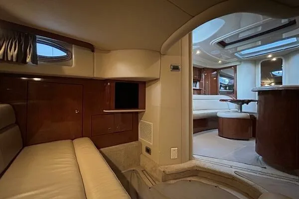  Yacht Photos Pics Interior of 2003 Sea Ray 420 Sundancer yacht, featuring luxurious seating and elegant wood finishes.
