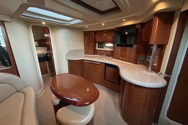  Yacht Photos Pics Luxurious interior of 2003 Sea Ray 420 Sundancer yacht with elegant wood finishes.