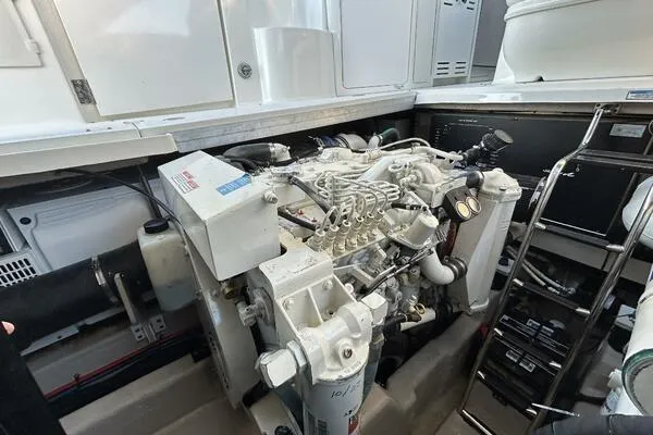  Yacht Photos Pics Engine room of 2003 Sea Ray 420 Sundancer, showcasing detailed mechanical components.