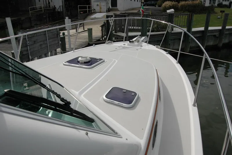Au Lapin Agile Yacht Photos Pics 2014 Back Cove 34 boat deck with hatches, docked at marina.