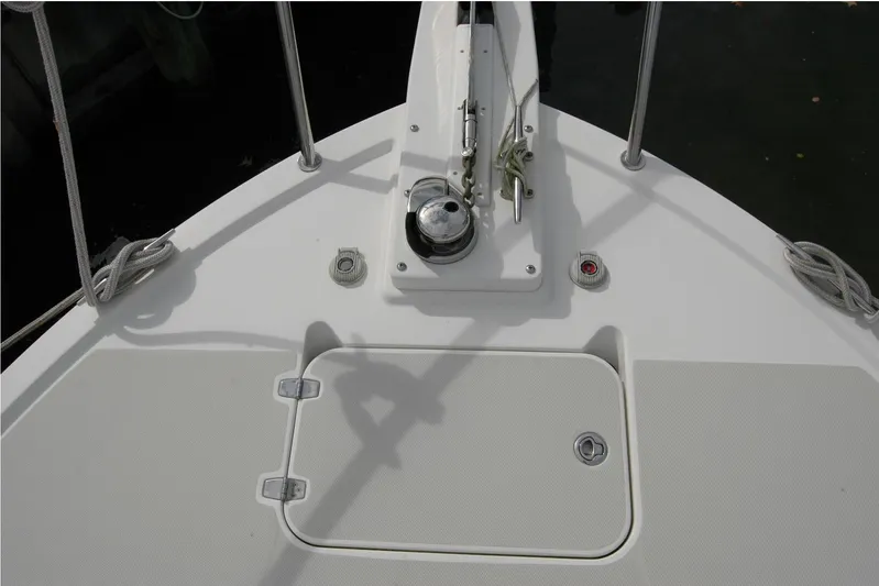 Au Lapin Agile Yacht Photos Pics Bow deck of 2014 Back Cove 34 boat with anchor winch and storage hatch.