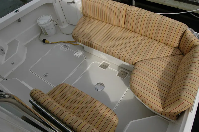 Au Lapin Agile Yacht Photos Pics 2014 Back Cove 34 boat interior with striped seating and clean deck layout.