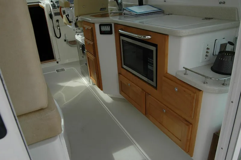 Au Lapin Agile Yacht Photos Pics Interior of 2014 Back Cove 34 yacht with kitchen area and microwave.