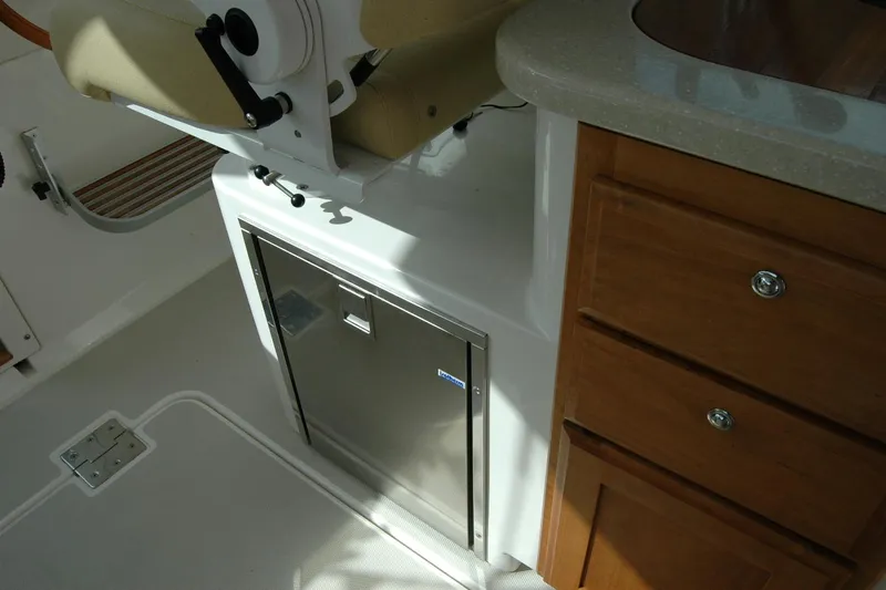 Au Lapin Agile Yacht Photos Pics Interior of 2014 Back Cove 34 boat with seating and cabinetry.