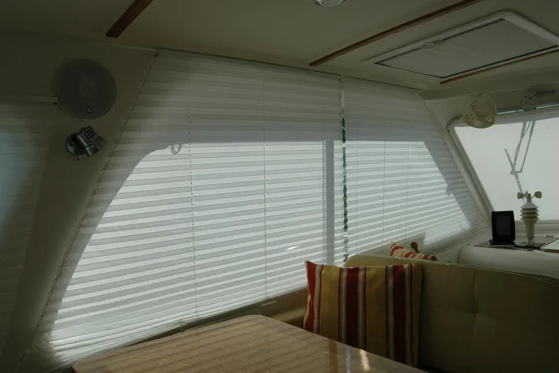 Au Lapin Agile Yacht Photos Pics Interior of 2014 Back Cove 34 yacht with blinds and striped cushions.