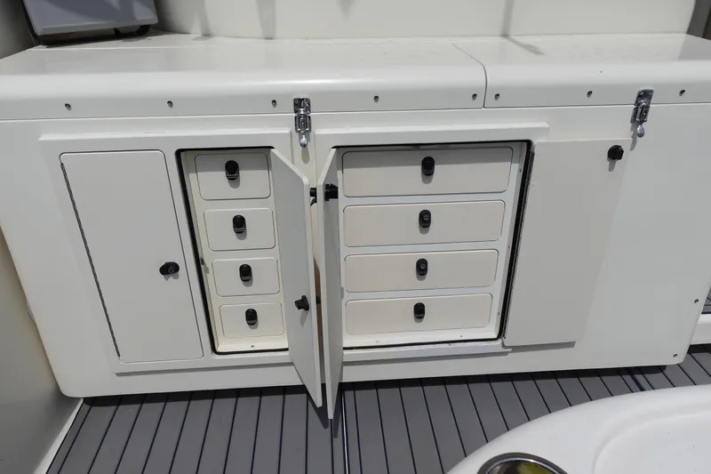  Yacht Photos Pics 2002 Carolina Classic 35 boat storage compartments with open drawers and cabinets.
