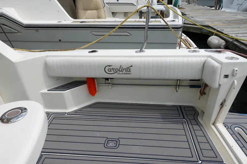  Yacht Photos Pics 2002 Carolina Classic 35 boat deck with logo, docked at marina.