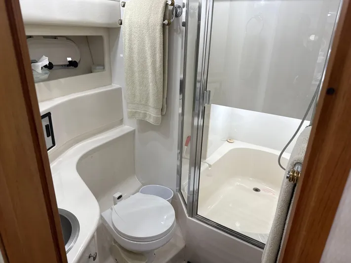  Yacht Photos Pics Bathroom interior of 2001 Bayliner 3988 Command Bridge Motoryacht, featuring shower and toilet.