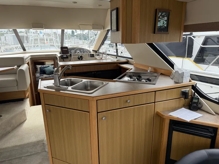  Yacht Photos Pics Interior of 2001 Bayliner 3988 Command Bridge Motoryacht with kitchen and helm.