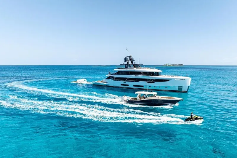  Yacht Photos Pics Luxurious 2024 Benetti Oasis 40 yacht cruising in clear blue ocean waters.