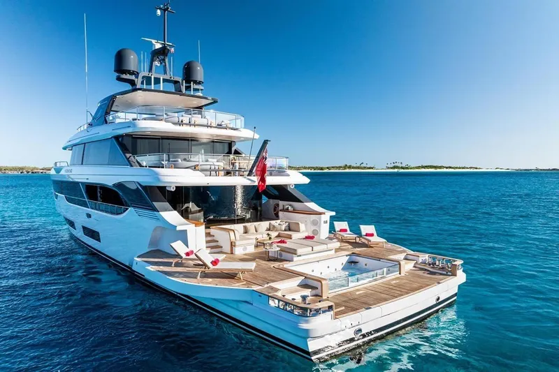  Yacht Photos Pics Luxurious 2024 Benetti Oasis 40 yacht with spacious deck and jacuzzi on open sea.