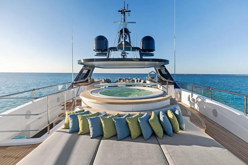  Yacht Photos Pics Luxurious 2024 Benetti Oasis 40 yacht deck with jacuzzi and ocean view.