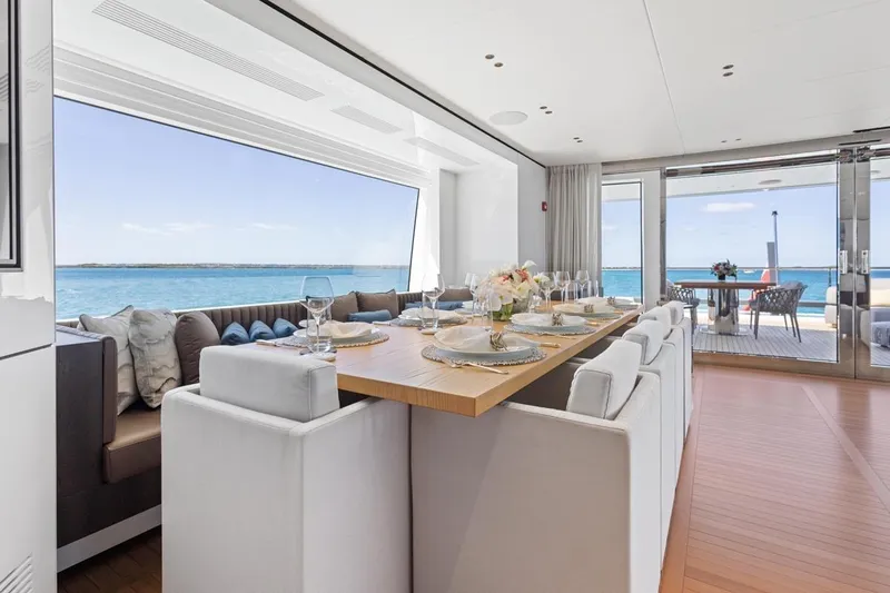  Yacht Photos Pics Luxurious dining area on 2024 Benetti Oasis 40 yacht with ocean view.