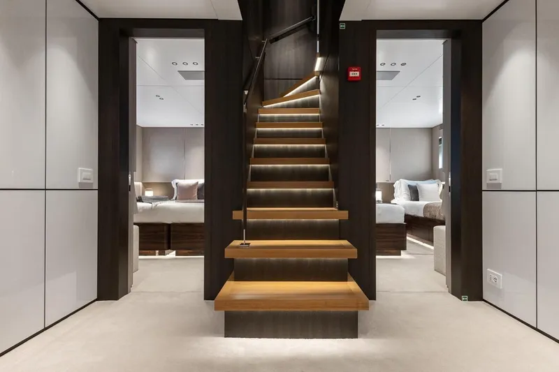  Yacht Photos Pics Luxurious interior of 2024 Benetti Oasis 40 yacht with elegant staircase and modern bedrooms.