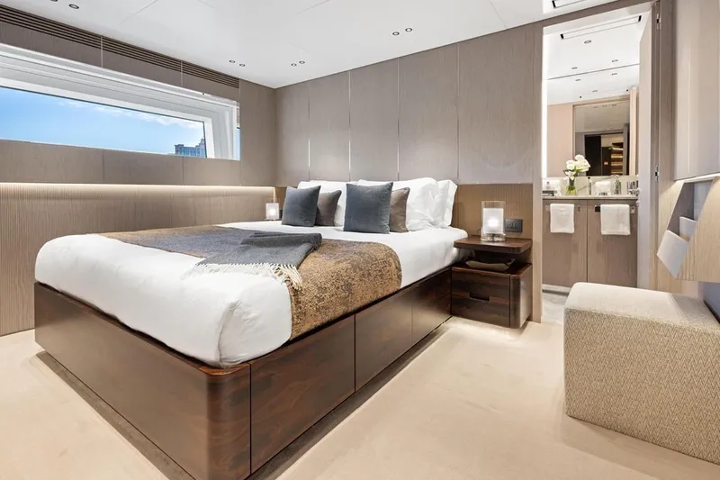  Yacht Photos Pics Luxurious bedroom interior of 2024 Benetti Oasis 40 yacht, featuring elegant design and modern amenities.