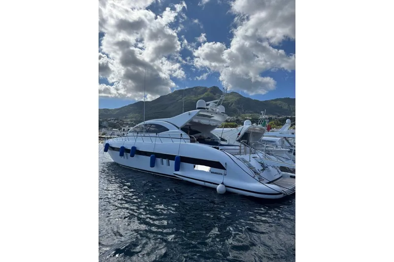  Yacht Photos Pics Luxury 2009 Overmarine Mangusta 72 HT yacht docked with scenic mountain backdrop.