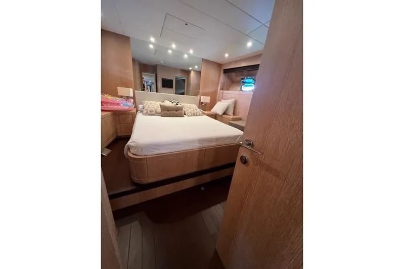  Yacht Photos Pics Luxurious bedroom interior of 2009 Overmarine Mangusta 72 HT yacht with modern design.