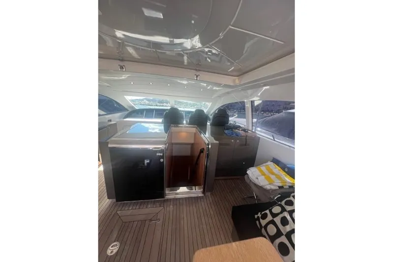  Yacht Photos Pics Interior of 2009 Overmarine Mangusta 72 HT yacht with modern seating and sleek design.