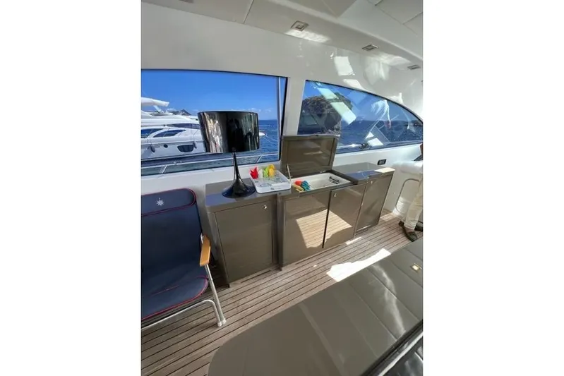  Yacht Photos Pics Luxurious interior of 2009 Overmarine Mangusta 72 HT yacht with modern furnishings and ocean view.